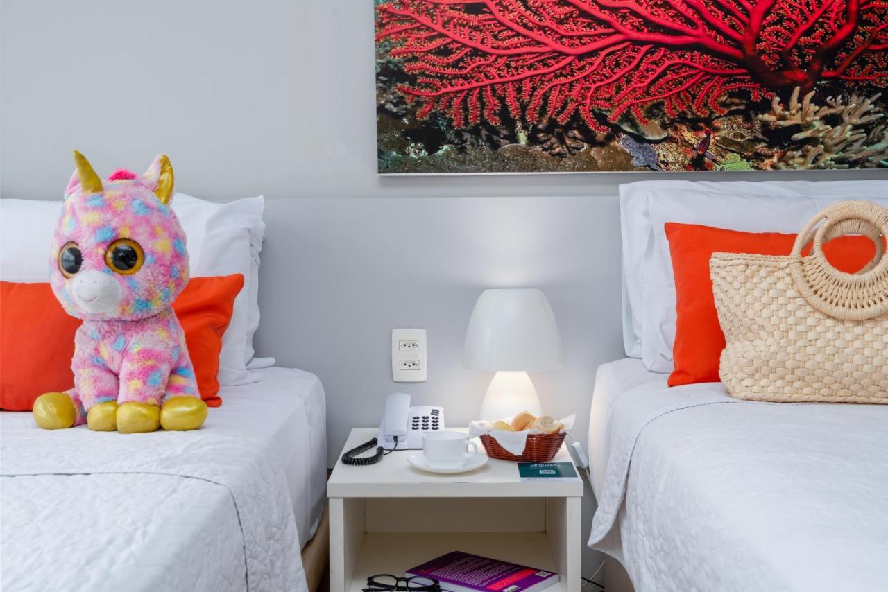 Quarto Triplo Standard (3 Adultos + 1 Criança)