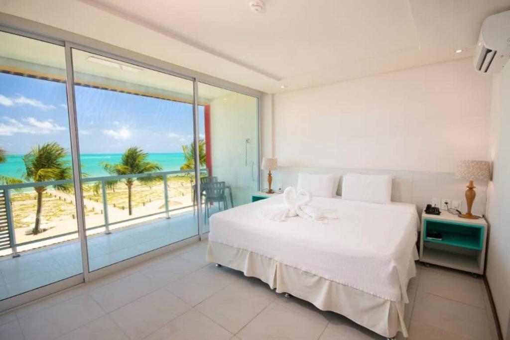 Quarto com Cama King-size e Vista do Mar