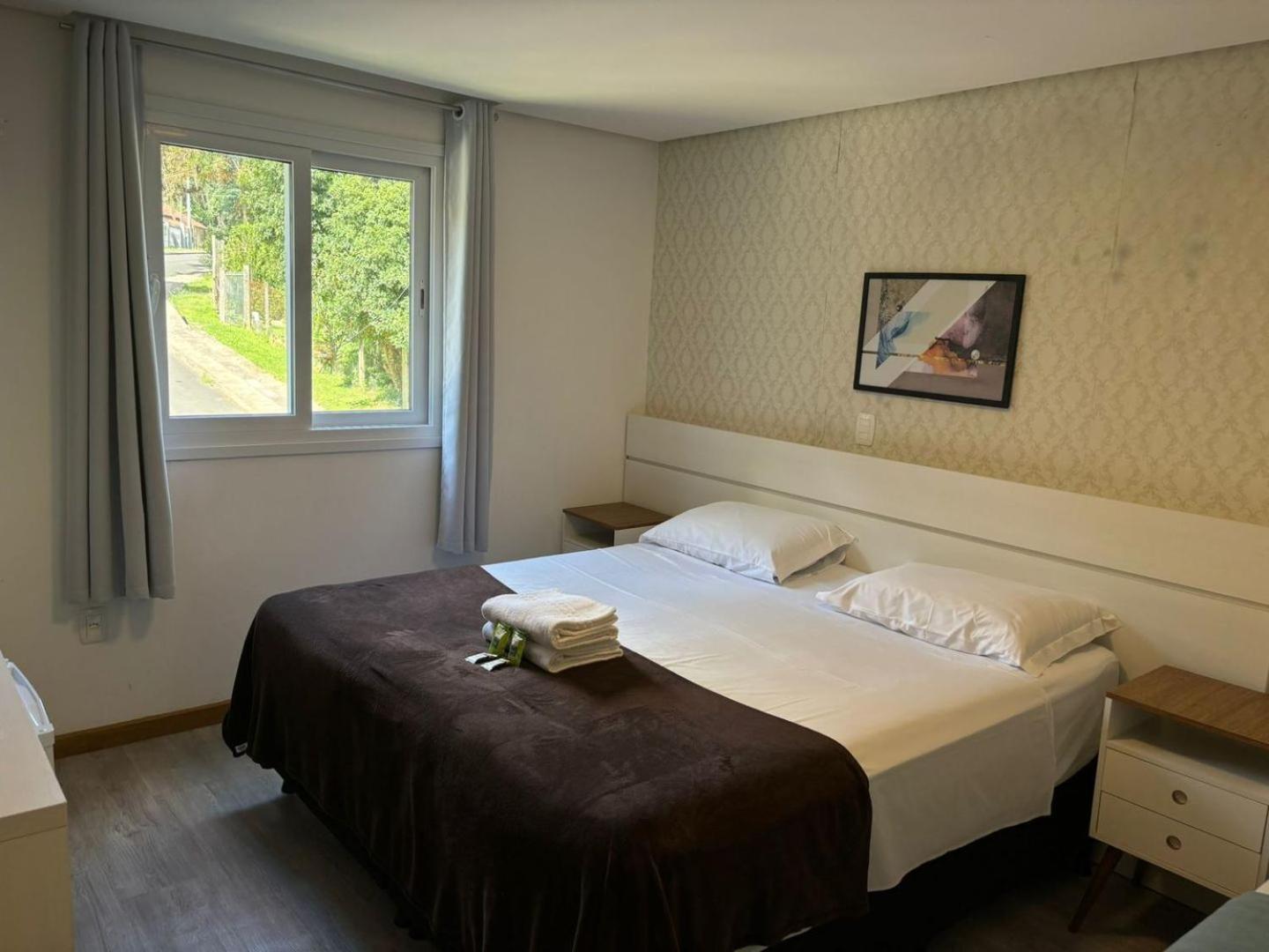 Quarto Triplo Luxo no Térreo