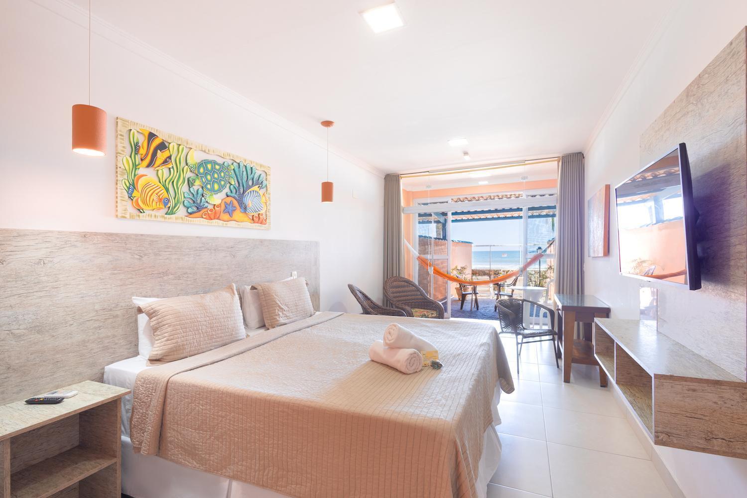 Quarto VIP com varanda e vista do mar