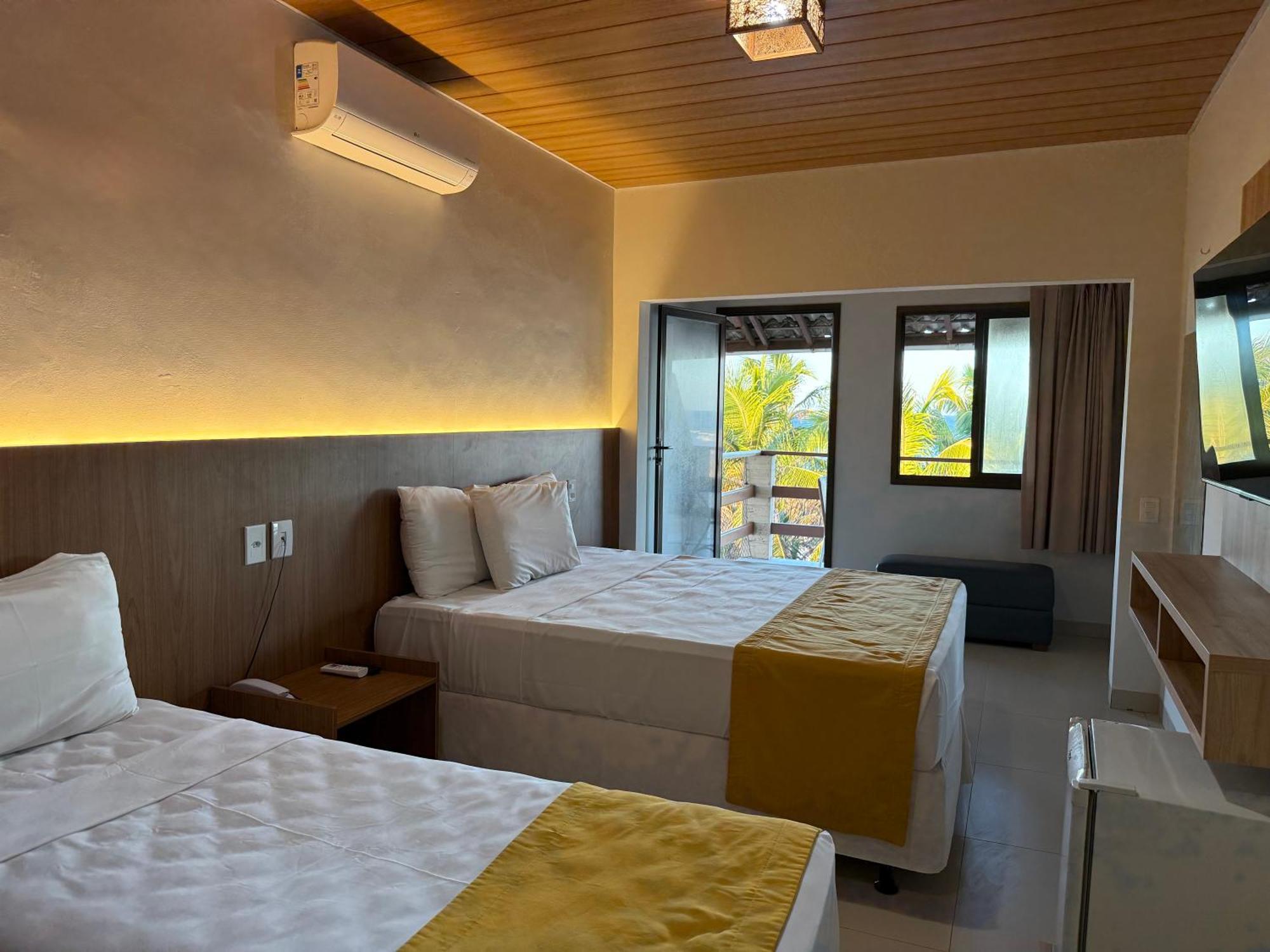 Quarto Triplo Deluxe com Vista do Mar