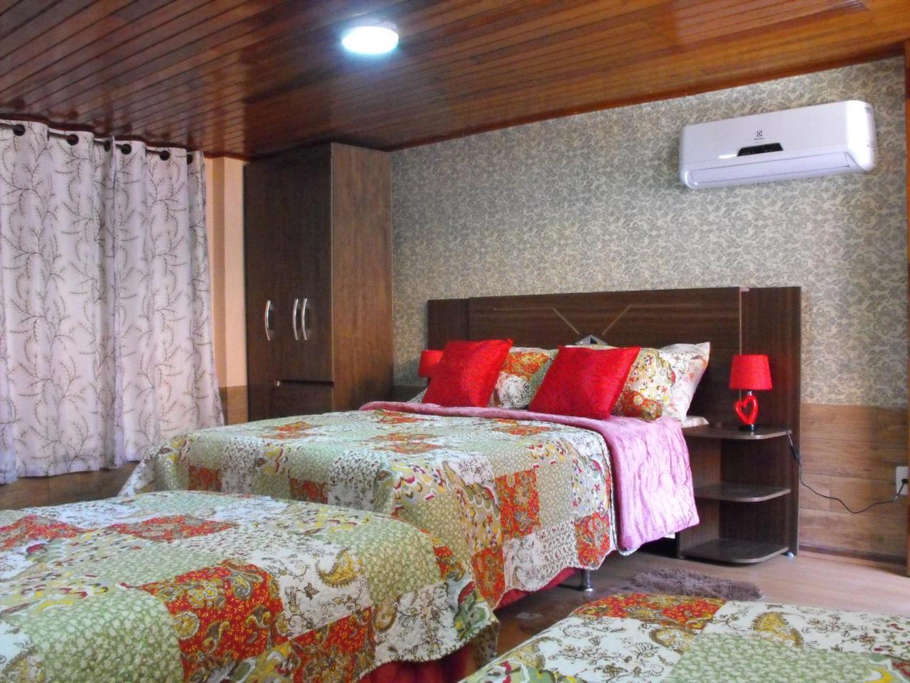 Quarto Quádruplo Premium
